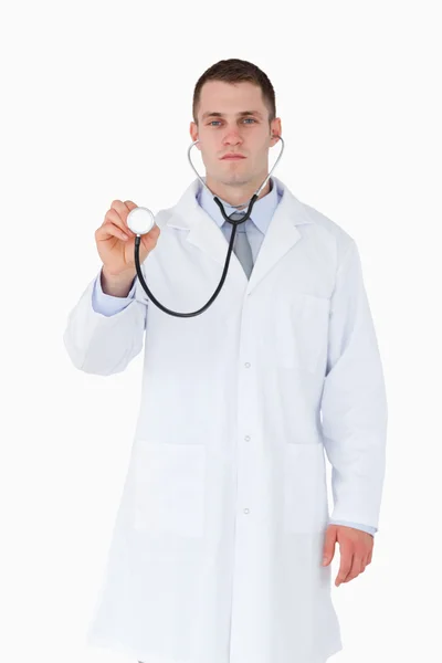 Serious looking doctor using stethoscope — Stock Photo, Image