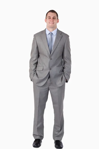 Smiling businessman with hands in his pocket — Stock Photo, Image