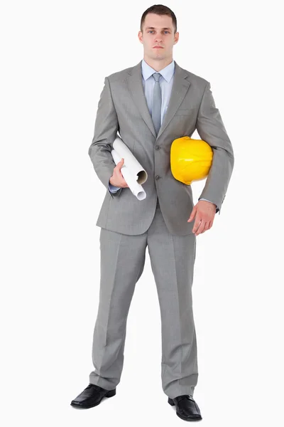 Architect with helmet and plans — Stock Photo, Image