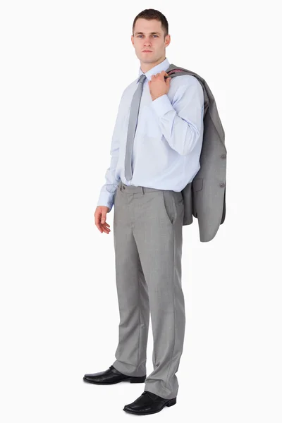 Бизнесмен в пальто, брошенном через плечо — стоковое фото
