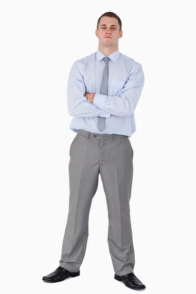 Serious looking businessman with his arms folded — Stock Photo, Image