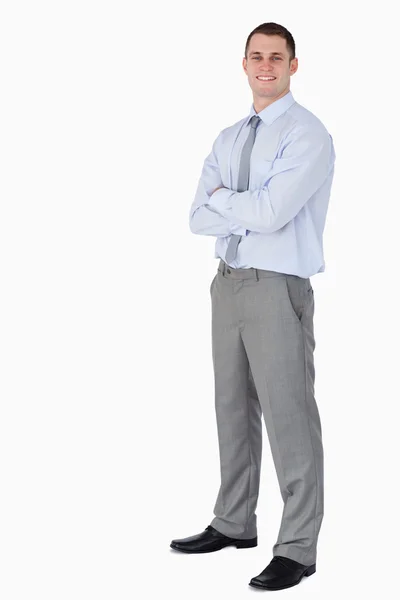 Smiling young businessman with arms folded — Stock Photo, Image