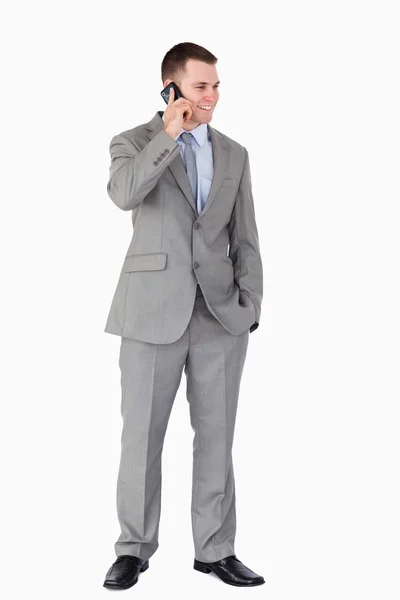 Businessman standing and phoning — Stock Photo, Image