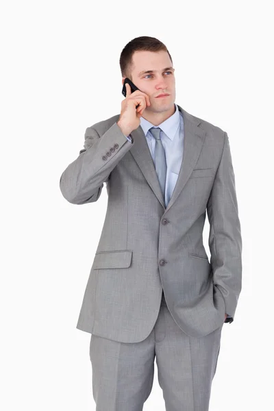 Close up of businessman on the cellphone in thoughts — Stock Photo, Image