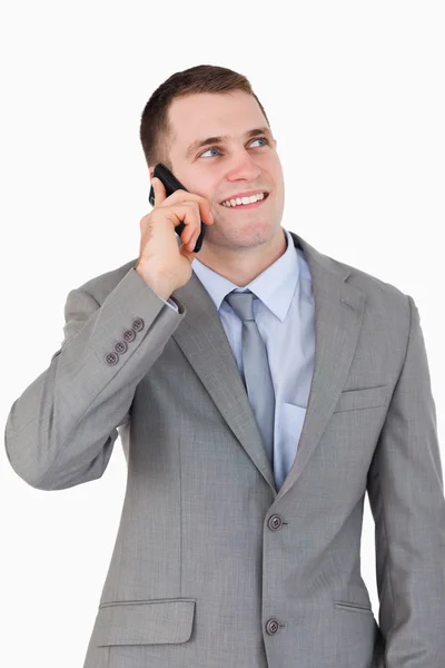 電話で笑顔の実業家のクローズ アップ — ストック写真