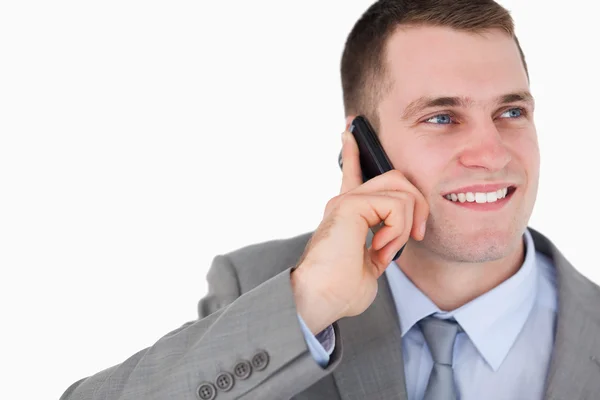 Close up of businessman looking up while on the mobile phone — Stock Photo, Image
