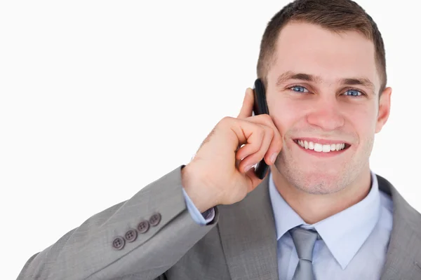 Close up of businessman on the mobile phone looking up — Stock Photo, Image