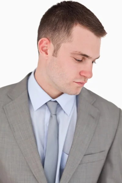 Close up of businessman looking down — Stock Photo, Image