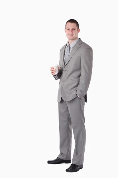 Portret biznesmena trzymając kubek kawy — Zdjęcie stockowe