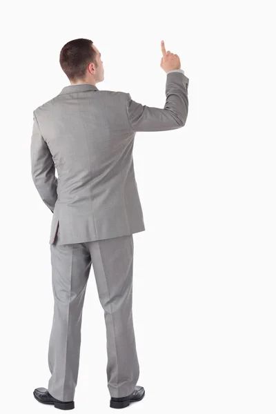 Portrait of a young businessman pointing at something — Stock Photo, Image