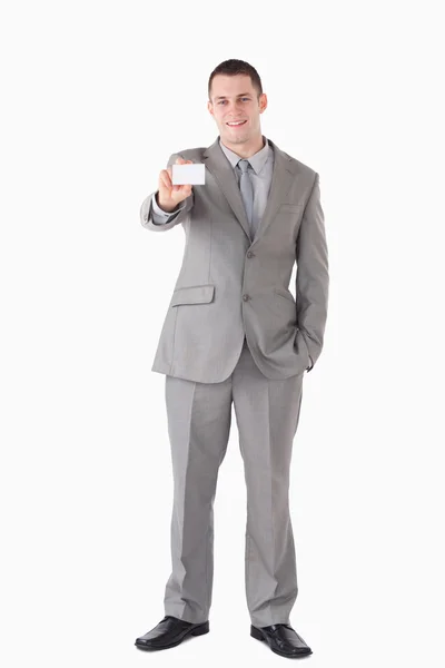 Portrait of a businessman showing a business card — Stock Photo, Image