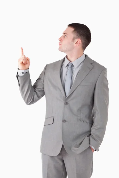 Portrait of a handsome businessman pointing at something — Stock Photo, Image