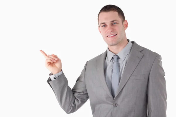 Young businessman pointing at something — Stock Photo, Image