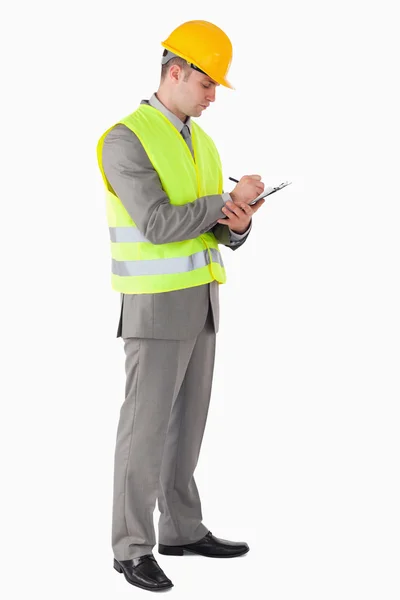 Portrait of a young contractor taking notes — Stock Photo, Image