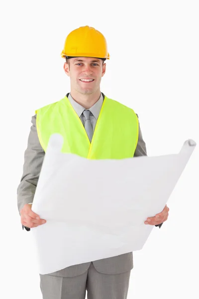 Retrato de um construtor olhando para um plano — Fotografia de Stock