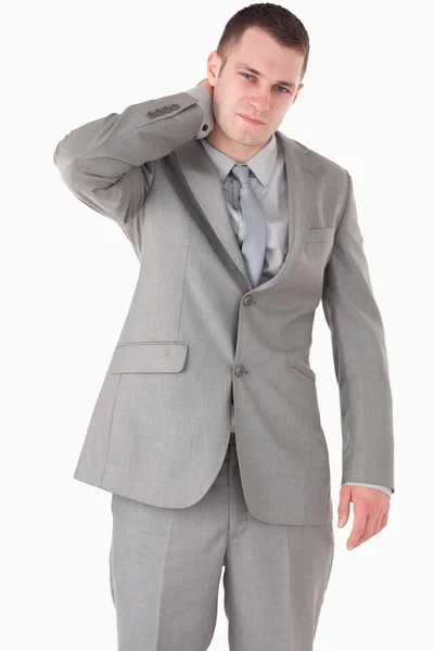 Portrait of a young businessman having a neck pain — Stock Photo, Image