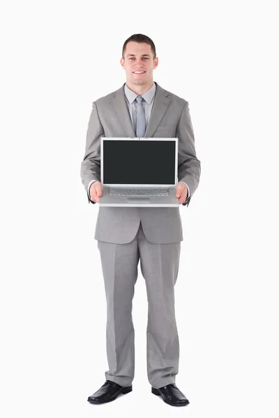 Retrato de um empresário segurando um laptop — Fotografia de Stock