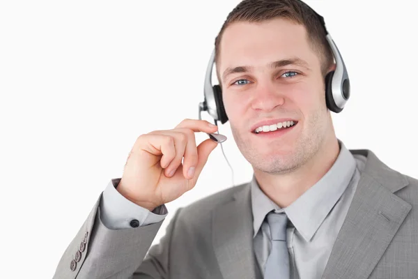 Operador sorridente usando um fone de ouvido — Fotografia de Stock