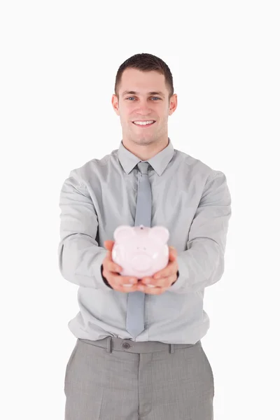Portret van een zakenman die houdt een piggy bank — Stockfoto