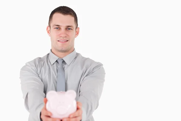 Businessman holding a piggy bank — Stock Photo, Image