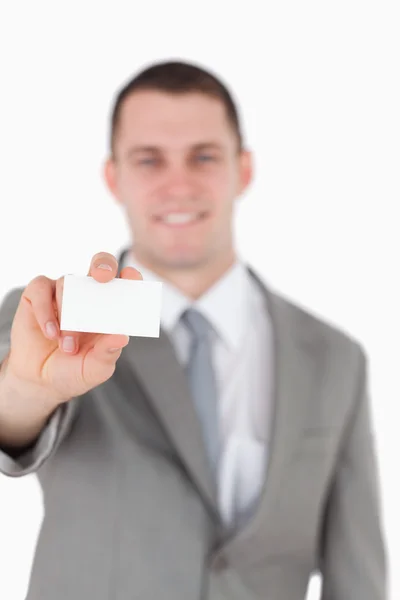 Portrait of a businessman showing a blank business card — Stock Photo, Image