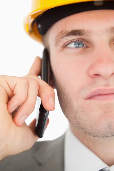 Close up of a young architect making a phone call — Stock Photo, Image
