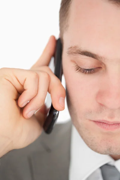 Close up of a sad businessman making a phone call — Stock Photo, Image