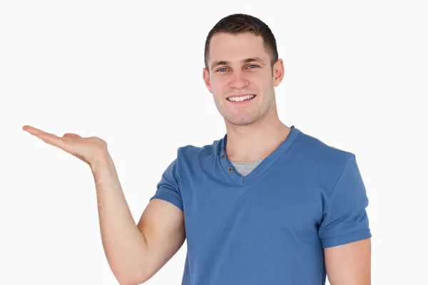 Smiling man holding something — Stock Photo, Image