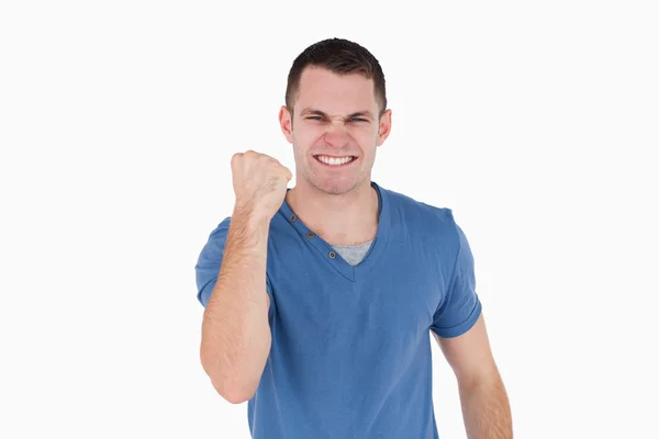 Smiling man with the fist up — Stock Photo, Image