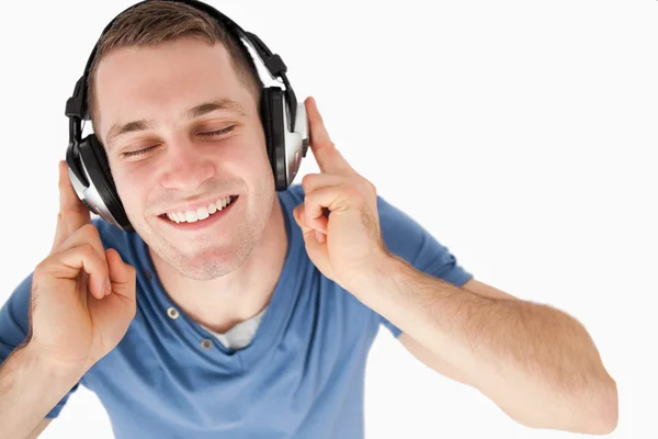 Happy man listening to music — Stock Photo, Image