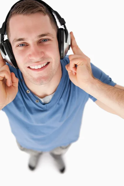 Portrait of a handsome man listening to music — Stock Photo, Image