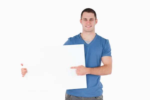 Man pointing at a blank panel — Stock Photo, Image