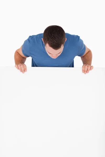 Portrait of a man looking at a blank panel — Stock Photo, Image