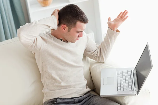 Lost man using a laptop — Stock Photo, Image