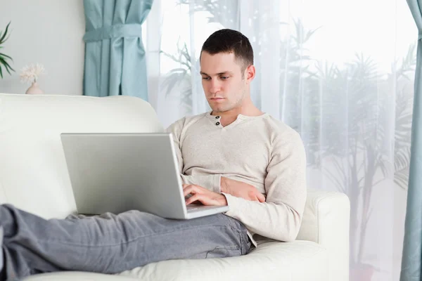 Young man working with his laptop — Stock Photo, Image