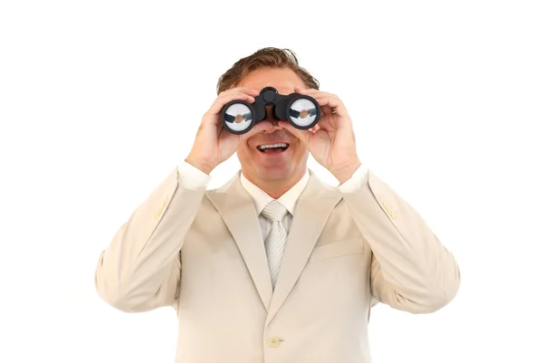 Hombre de negocios sonriente mirando a través de los prismáticos —  Fotos de Stock