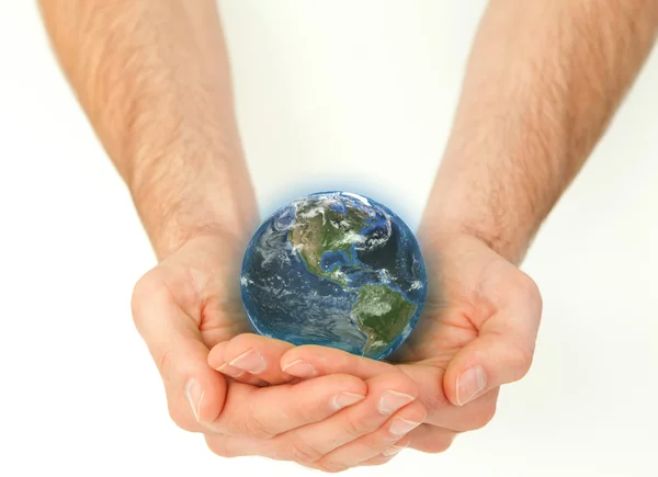 Maskulina händer som håller en planet jordglob — Stockfoto