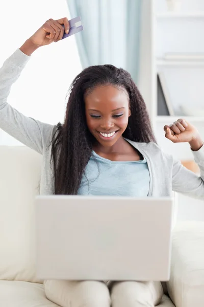 Close up of young woman happy about online shpooing — Stock Photo, Image