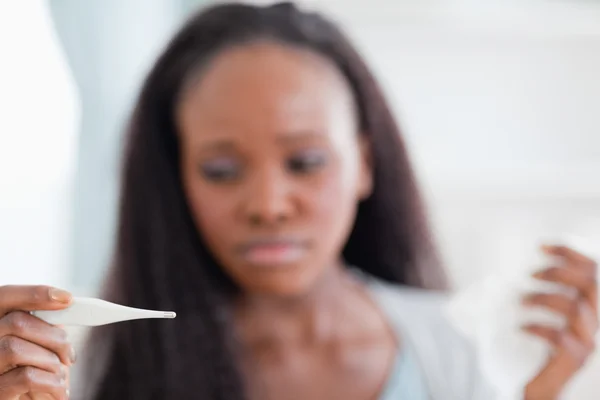 Close up of thermometer being used by woman — Stock Photo, Image