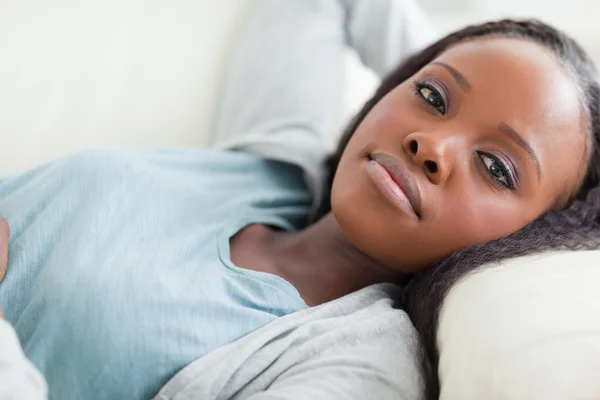 Close up of woman taking a rest on the sofa — Stock Photo, Image