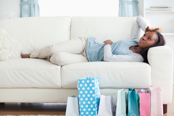 Woman taking a rest after shopping — Stock Photo, Image