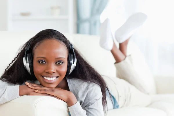 Smiling woman with headphones on — Stock Photo, Image