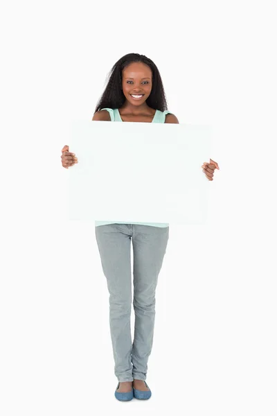 Woman with placeholder on white background — Stock Photo, Image