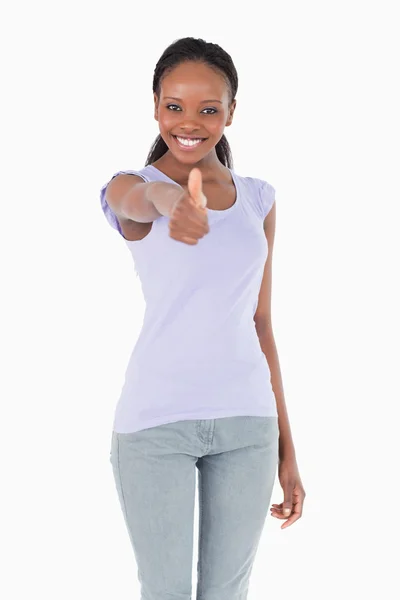 Close up of woman giving thumb up on white background — Stock Photo, Image
