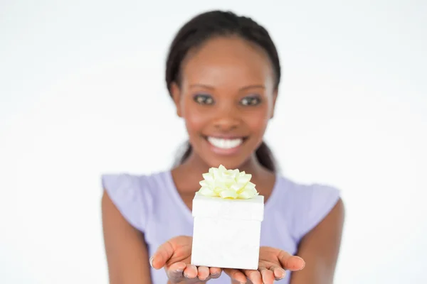 Close up of present being held by woman against a white backgrou — Stock Photo, Image