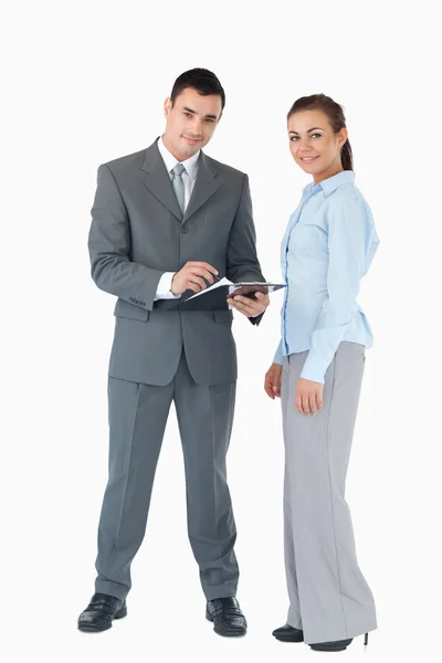 Business team with clipboard against a white background — Stock Photo, Image