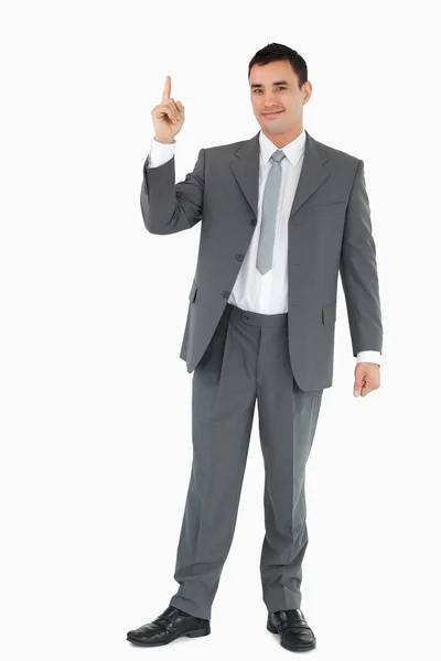 Businessman pointing upwards — Zdjęcie stockowe