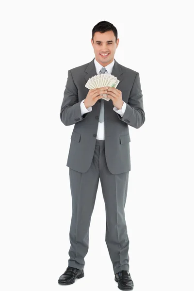 Uomo d'affari con banconote — Foto Stock