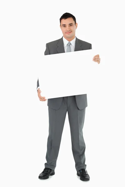 Empresario sosteniendo el cartel —  Fotos de Stock