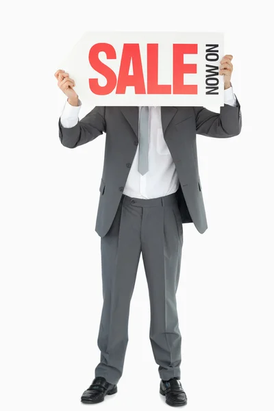 Businessman with sign in front of his head — Stock Photo, Image